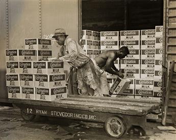 (WATERMAN STEAMSHIP CORP--SHIPPING) A group of three photographs depicting African American men unloading cargo of Carnation Milk in Mo